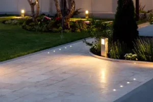 Lights illuminating path at night. Grasshoppers talks about the benefits exterior lighting can add to your Orlando FL business