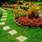 Beautifully landscaped lawn with pavers. Grasshoppers talks about the risks of DIY landscaping design for people in the Orlando FL area.