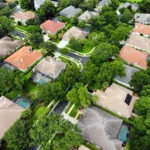 Aerial view of a neighborhood with green trees in Orlando, FL