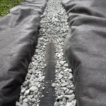 digging the trench during a french drain catch basin installation in orlando