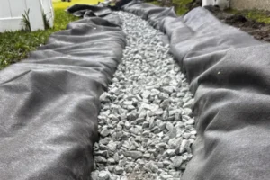 closeup of a French Drain system installation in Orlando FL