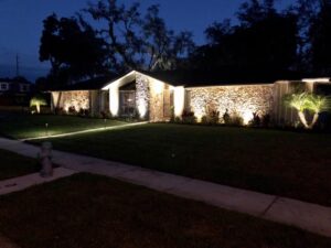 Florida home with professionally installed lighting within an HOA