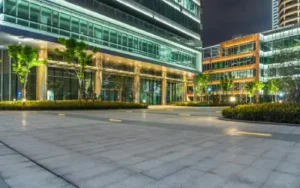 dramatic lighting design for florida office building highlights trees and facade