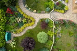 A landscape redesign featuring many different foliage and plants best suited to the house.