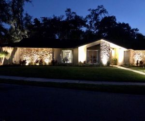 Florida home with professionally installed lighting within an HOA