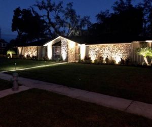 Florida home with professionally installed lighting within an HOA